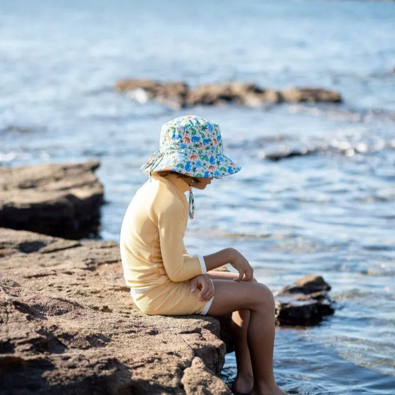 Acorn Kids: Wide Brim Swim Bucket Hat Prehistoric Natural Blue Orange